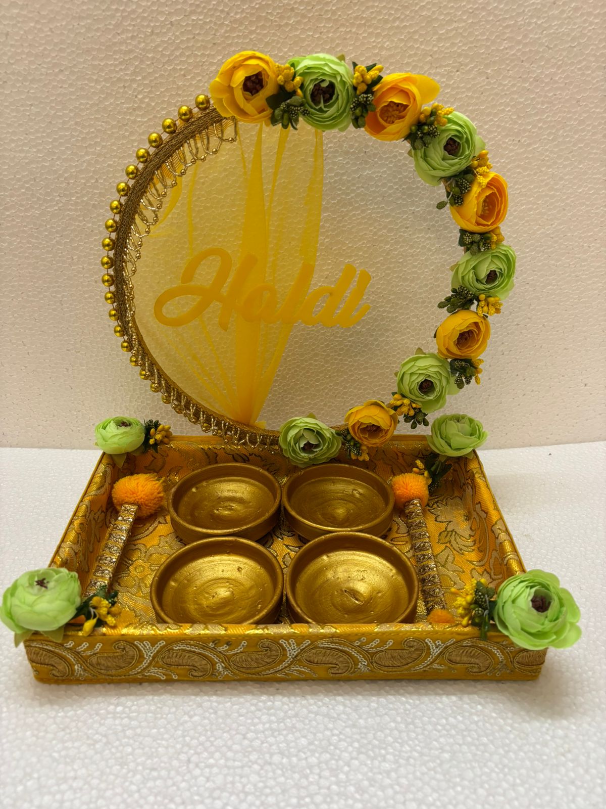 Handmade Haldi Platter decorated with yellow and green flowers, golden beads, and four golden bowls for wedding and festive rituals