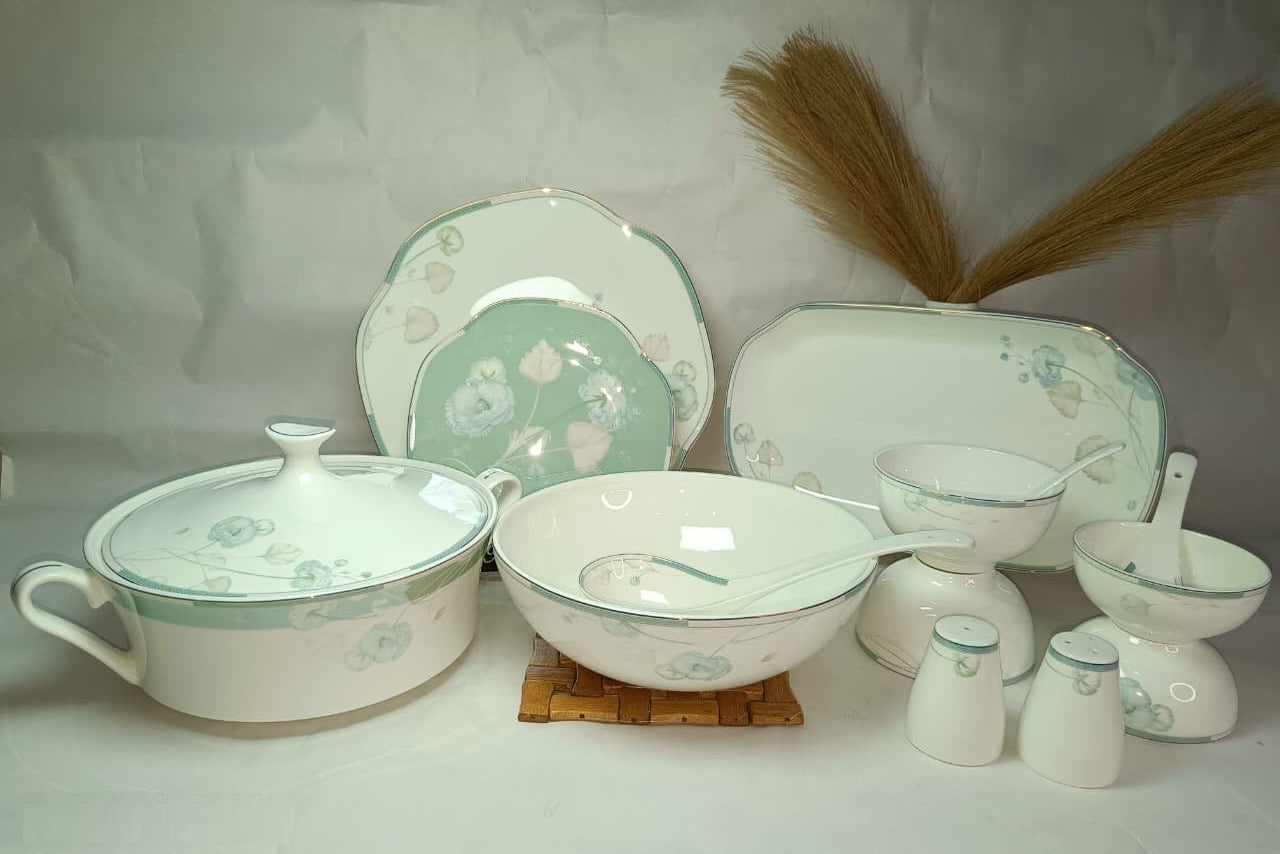 Set of ceramic dishes with floral patterns on a white background