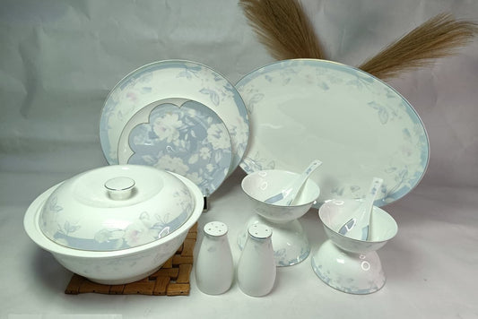 Set of ceramic dishes with floral patterns on a white background