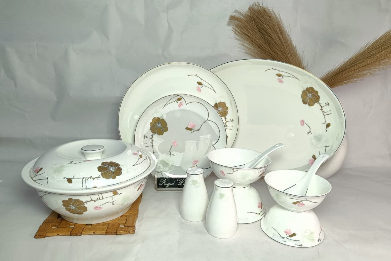 Set of ceramic dishes with floral patterns on a white background