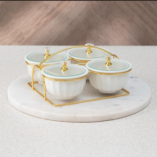 Luxury porcelain candy and dry fruit jar set with crystal lid knobs in gold metal stand displayed as coffee table serving centerpiece