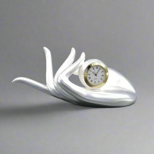 A 999 Pure Silver Plated Palm Clock with a white and gold color scheme, featuring a small analog clock face in the center.